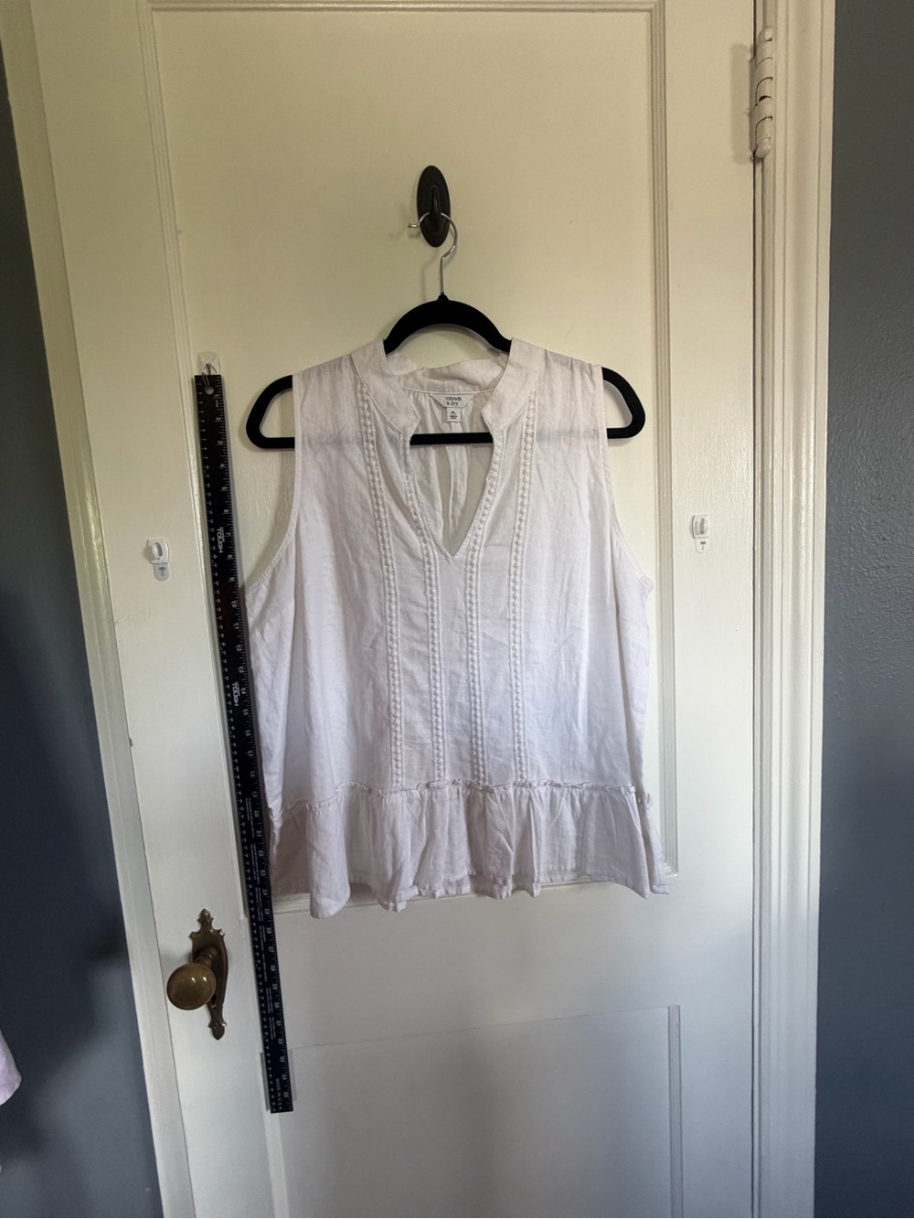 NWOT - White Sleeveless V-Neck Peplum Top